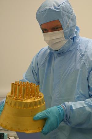 Richard Wylde holding the Planck HFI focal plane structure